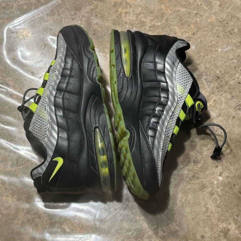 Nike Air Max ‘95 GS 
Black and volt-dark grey color
Kids size 3.5